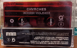 A cassette with the word CVURCHES written on it. The has the album title 'Screen Violence'.